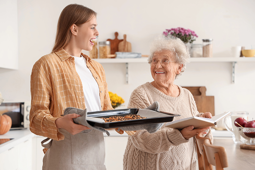 young-woman-holding-baking-tray-1